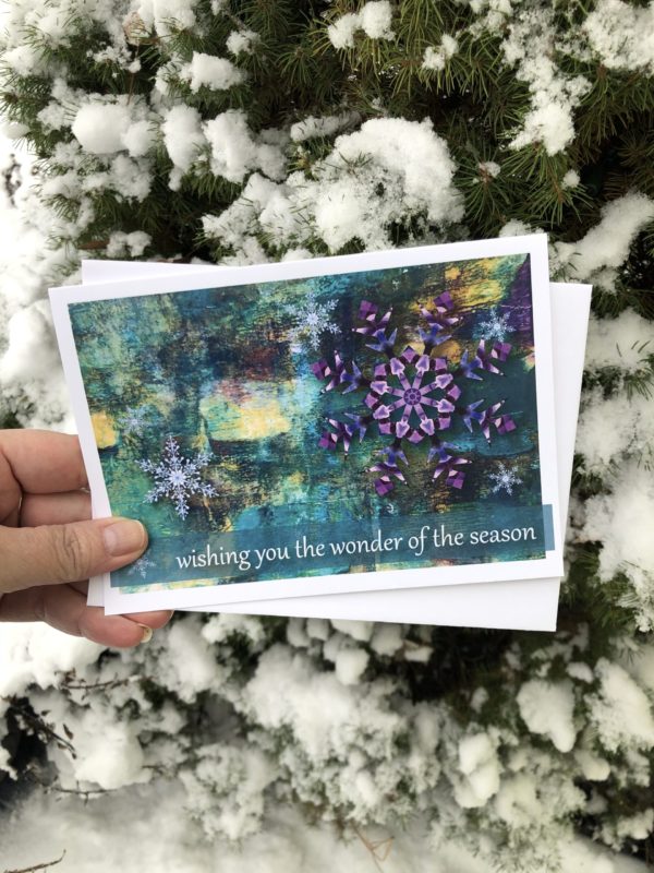 a holiday greeting card with snowflakes